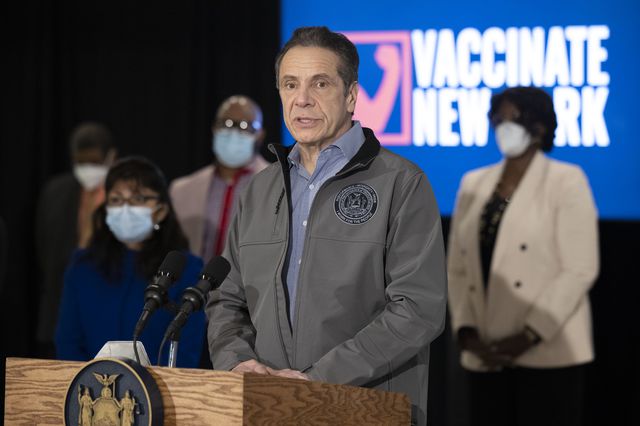 Governor Andrew Cuomo, wearing a NY State windbreaker, at the a lectern during a press conference